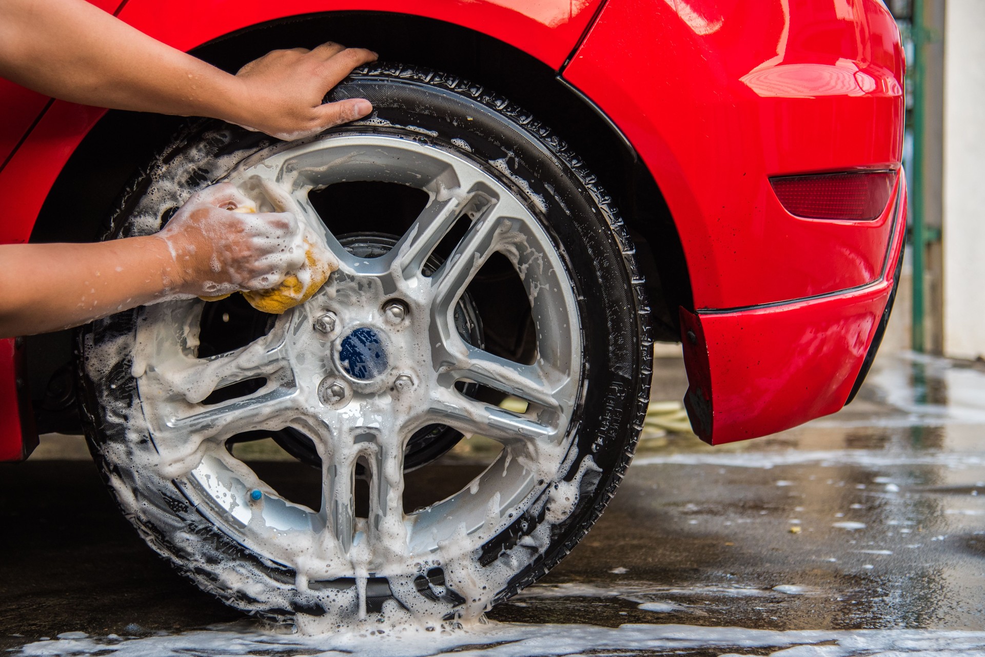 Cleaning red car, Automobile washing concept